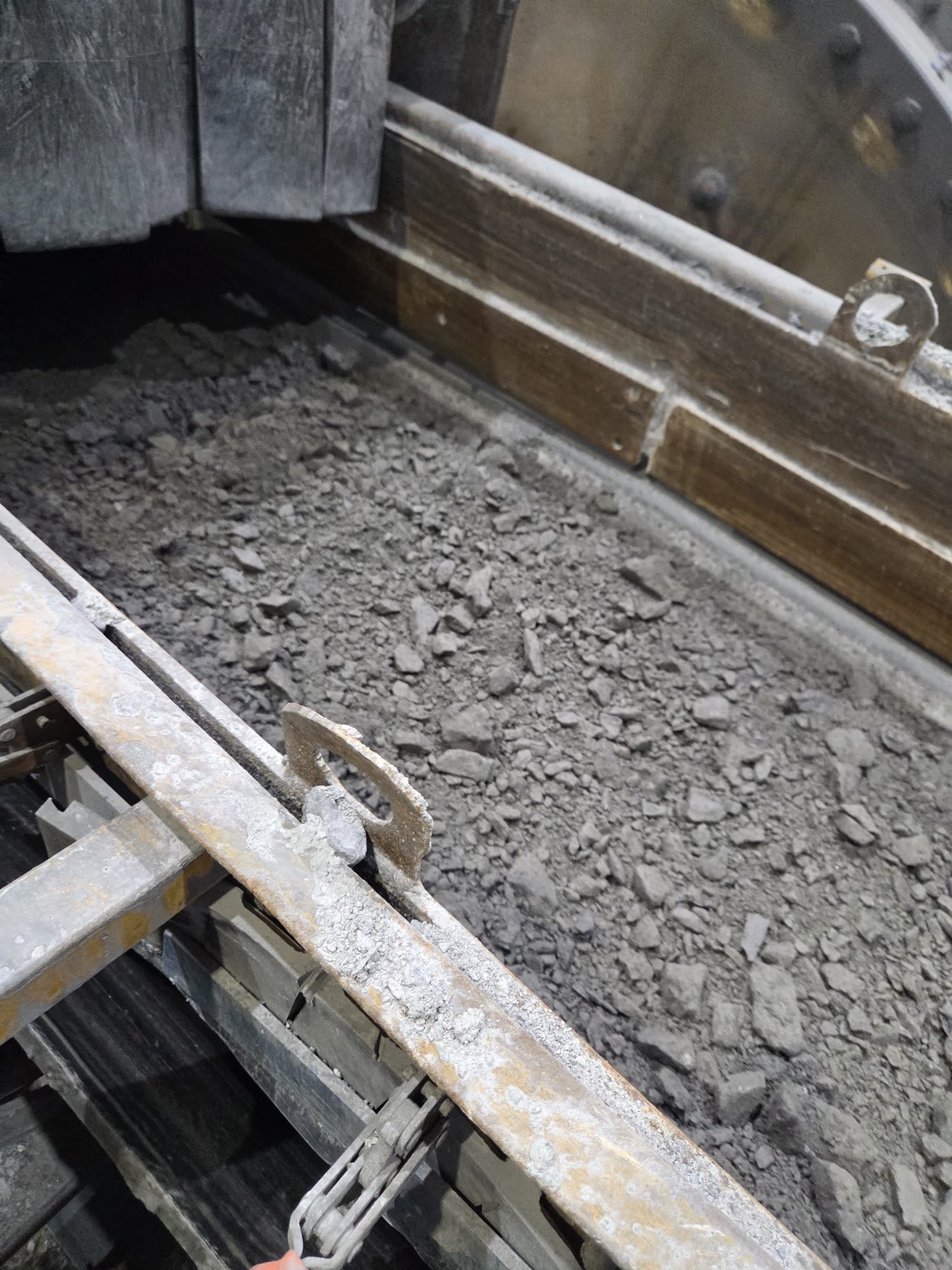 Crushed rock in a transfer chute